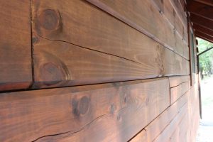 log cabin stain highlights wood