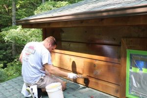 hand applied staining for log cabin